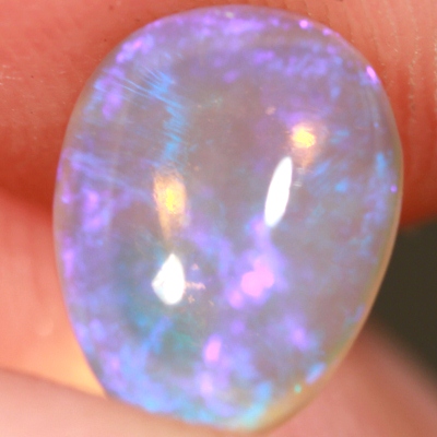 SOLID CRYSTAL OPAL Transparent with purple moving within